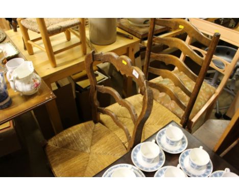 Two rush seated ladder back chairs; and a painted dining chair 