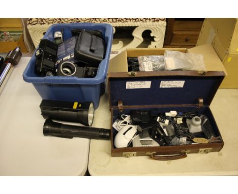 A Panasonic camcorder; two torches; and two boxes containing various electrical items; camera related equipment etc. 
