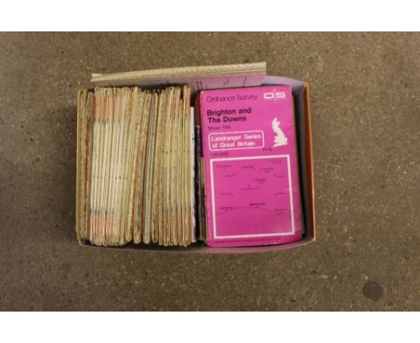 A box of Ordnance Survey maps and booklets