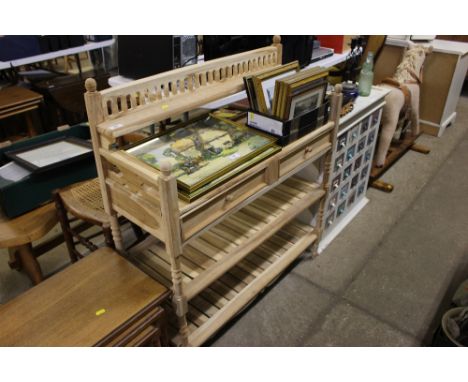 A stripped pine shelf fitted two drawers 