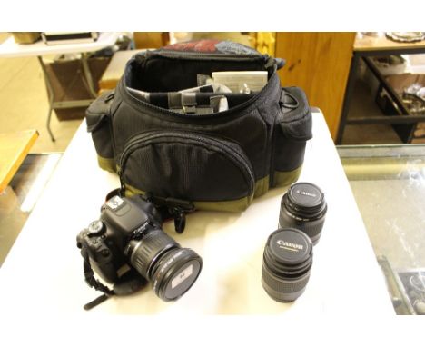 A Canon EOS600D SLR camera with bag; two extra lenses; various accessories, but lacking charger