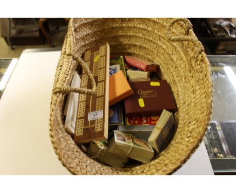 A basket containing crib board and playing cards 
