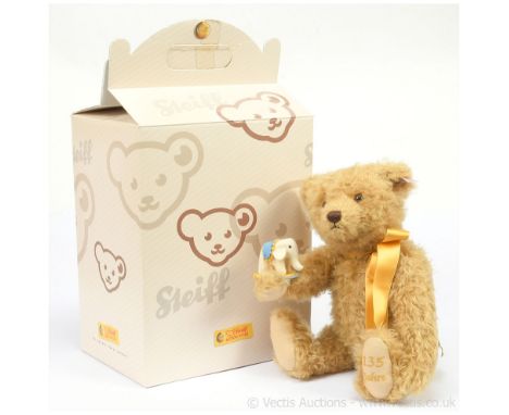 Steiff 135 Year Jubilee teddy bear, white tag 034046, LE 1880, 2015, golden blonde mohair, he holds a felt elephant with a co