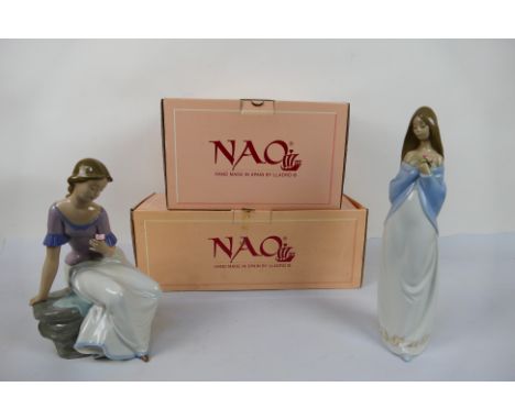 Two boxed Nao figures comprising # 1392 and # 1344, largest approximately 31 cm (h). [2]. [W]