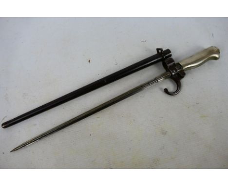 A French model 1886 bayonet with 34 cm (l) cruciform blade, with scabbard. [W]