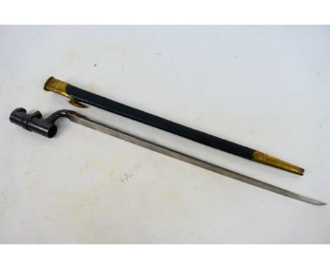 A pattern 1853 socket bayonet, 43 cm (l) triangular blade, with brass mounted scabbard. [W]

Condition Report: Muzzle ring di