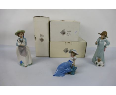 Three boxed Nao figures comprising # 1042, # 1163 and other, largest approximately 25 cm (h). [3]. [W]