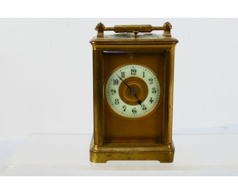 A late 19th / early 20th century French gong striking carriage clock with repeat mechanism, cylinder escapement, corniche cas