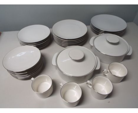 Thomas of Germany, a six place setting comprising graduated dinner plates in four sizes, two lidded tureens, and four mugs by