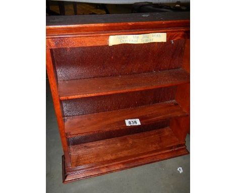 A mahogany shelf unit. (collect only)