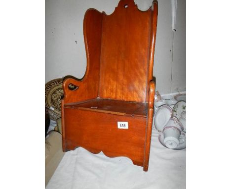 A Victorian rocking child's commode chair.