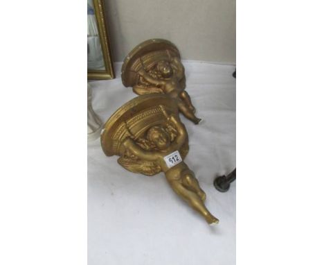 A pair of gilded plaster cherub wall brackets.*CONDITION REPORT*There are numerous chips to planter in places.Top 'D' shelf W