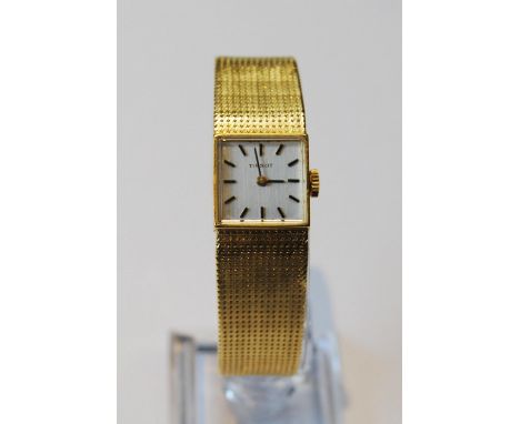 Lady's Tissot 18ct gold watch with square dial, on integral Milanese bracelet, 41g including movement (38.6g without).
