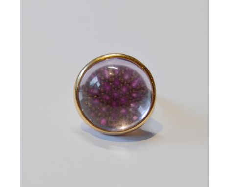 18ct gold dress ring with a pavé cluster of rubies magnified under a rock crystal cabochon, by Joseph Bonnar, size M. 