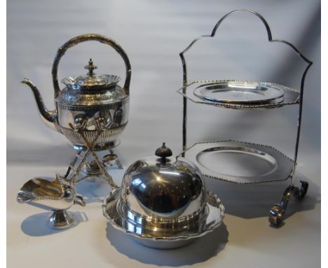 BM tea kettle with stand and lamp, a sugar scuttle, a muffin dish and cover, a plate, and a cake stand. 