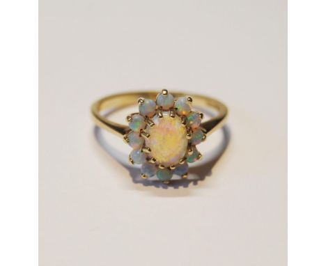 Opal oval cluster ring, in 9ct gold, size O. 