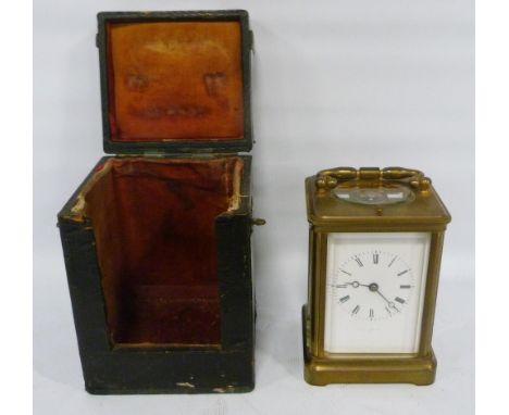 Brass four glass carriage clock with movement viewing window to the top, 12cm high, with tooled case.CONDITION REPORT: Not cu