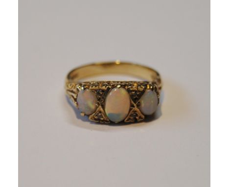 Opal three-stone ring of Edwardian style with diamond chips, in 9ct gold, size N½, 4.3g gross. 