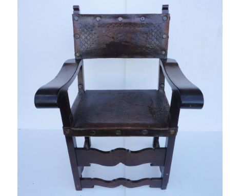 Spanish walnut and elm armchair in the 17th century style, with Cordoban-style leather back rest and seat, scroll arm rests a