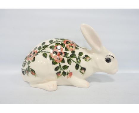 Griselda Hill (Wemyss) Large figure of a rabbit decorated with underglazed wild roses, on green stalks and leaves, inscribed 