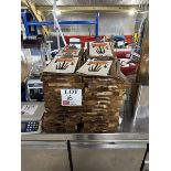Assorted quantity of wooden serving boards and menu clipboards