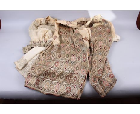 A Middle Eastern embroidered skirt, a beadwork top, an embroidered sash and an embroidered wraparound skirt