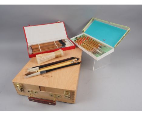 A Winsor &amp; Newton Artist's travelling easel and box and a collection of Oriental calligraphy brushes 