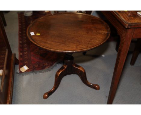 A 19th century mahogany circular tilt top occasional table, on turned column and tripod splay supports, 22 1/4" dia x 21" hig