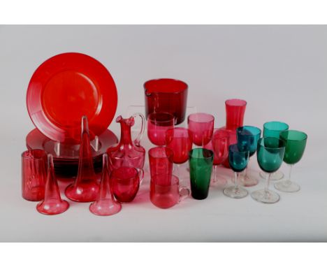 Nine Georgian ruby glass plates, a similar wine glass cooler, three trumpet glasses, five green pedestal glasses, various, an