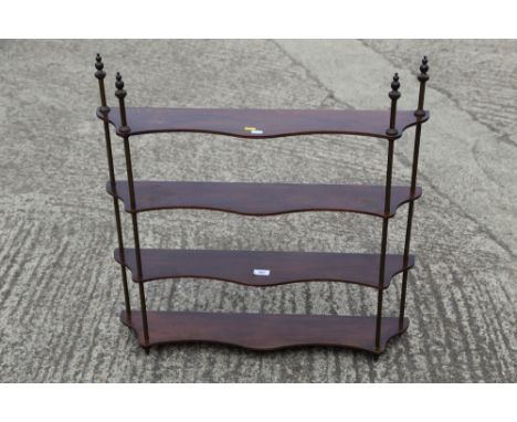 A mahogany and brass four-tier serpentine open shelf, 30" wide x 6" deep x 30" high 