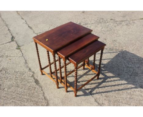 A late 19th century mahogany nest of tables, on barley twist supports, and a mahogany shaped top occasional table, on tripod 