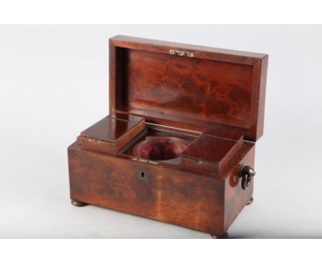 An early 19th century mahogany tea caddy with blending bowl and ring handles, on bun feet, 12" wide, and four lignum vitae bo