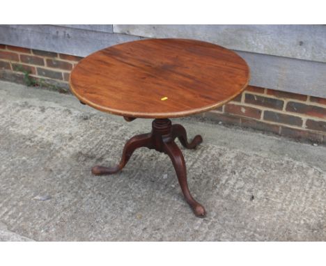 A Georgian mahogany circular tilt top coffee table, on turned column and tripod splayed supports, 29 3/4" dia x 21 1/2" high 