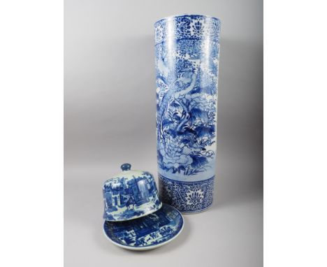 A Chinese blue and white cylindrical stick stand and a blue and white cheese dish 