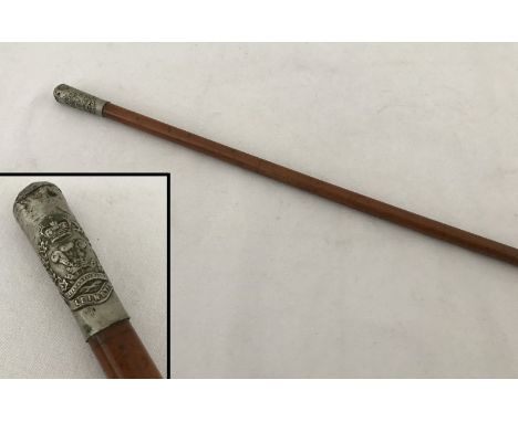 A c.WW1 swagger stick for The Leinster Regiment. White metal top with Leinster Regimental crest. 