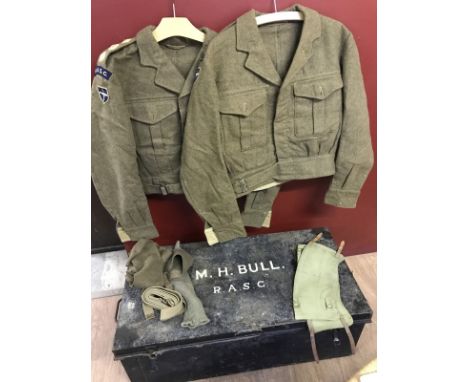 An Officers trunk with two Battle dress jackets (Lieut & Capt) and other items of kit. Trunk named. 