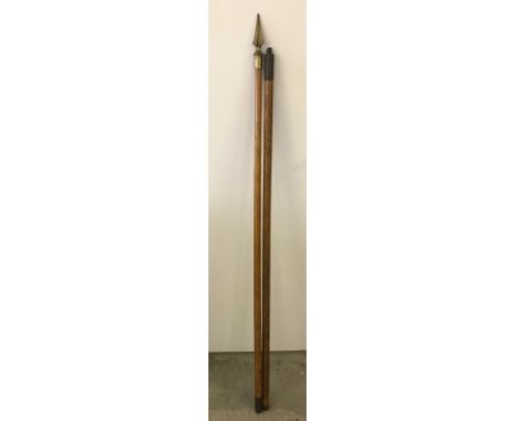A vintage flagpole in 2 parts with brass finial.  
