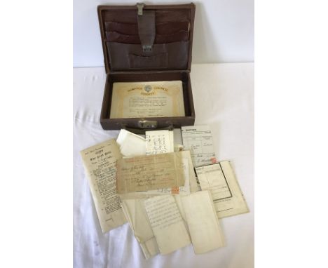 A small brown case containing ephemera. Ephemera to include WW1 Certificate of Service in the Royal Navy. 