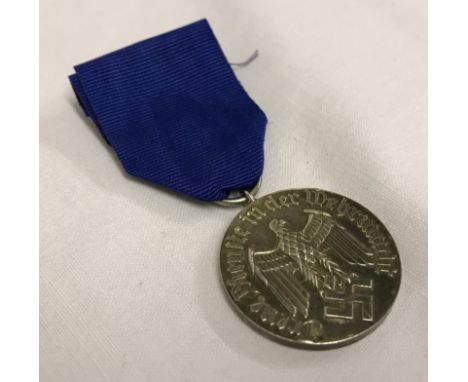 A German Army 4 year long service and good conduct medal.  