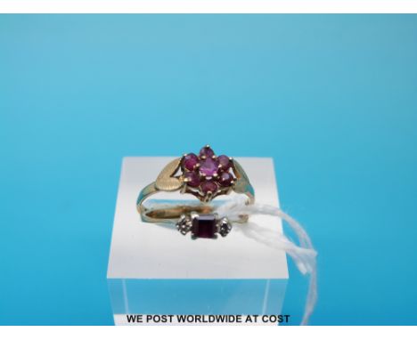 A 9ct gold ring set with a ruby flanked by diamonds and a 9ct gold ring set with a cluster of garnets, sizes K & P/Q (3g)