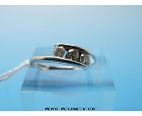 A 9ct gold ring set with three diamonds, size K (2.3g)