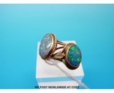 Two 9ct gold rings both set with oval opal cabochons, size LM and Q (6.1g) 