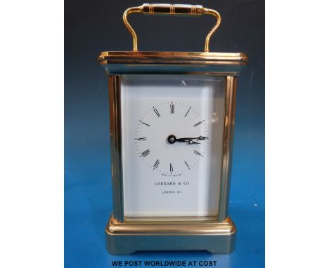 A brass carriage clock with Garrard & Co to face