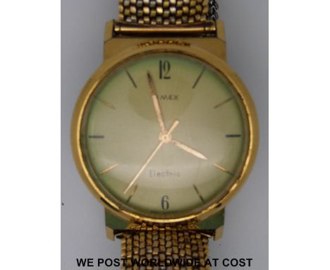 Timex electric gentleman's wristwatch with gold hands and baton markers on patterned face in gold plated case, on expanding m