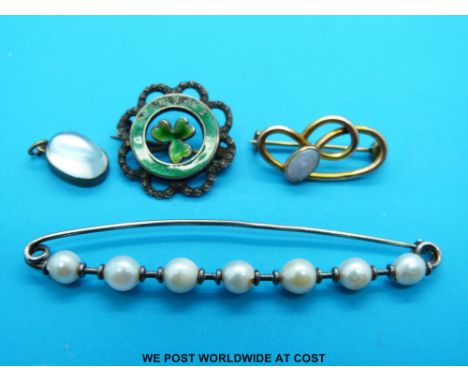 A 9ct gold brooch set with an opal by Charles Horner, a silver brooch set with pearls, a moonstone pendant and a hallmarked s