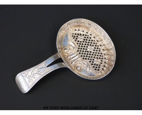 A hallmarked silver George III early tea strainer in the form of a caddy spoon, B'ham 1806, maker Cocks and Betteridge, lengt