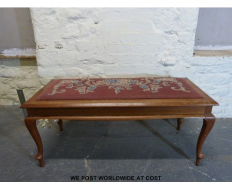 An oak window seat/duet piano stool, on cabriole legs and with padded tapestry seat (W113cm) 
