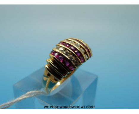 An 18ct gold ring set with rows of diamonds and rubies, size R (6.5g)