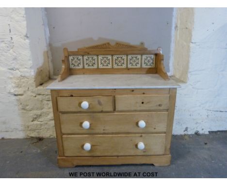 A pine washstand with tile back, marble top and two over two drawers below (W107 x D51 x H106cm) 