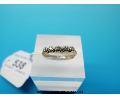 A yellow metal ring marked 18ct set with five diamonds size K (1.7g)